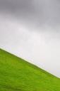 Steep green field (free iPhone wallpaper)
